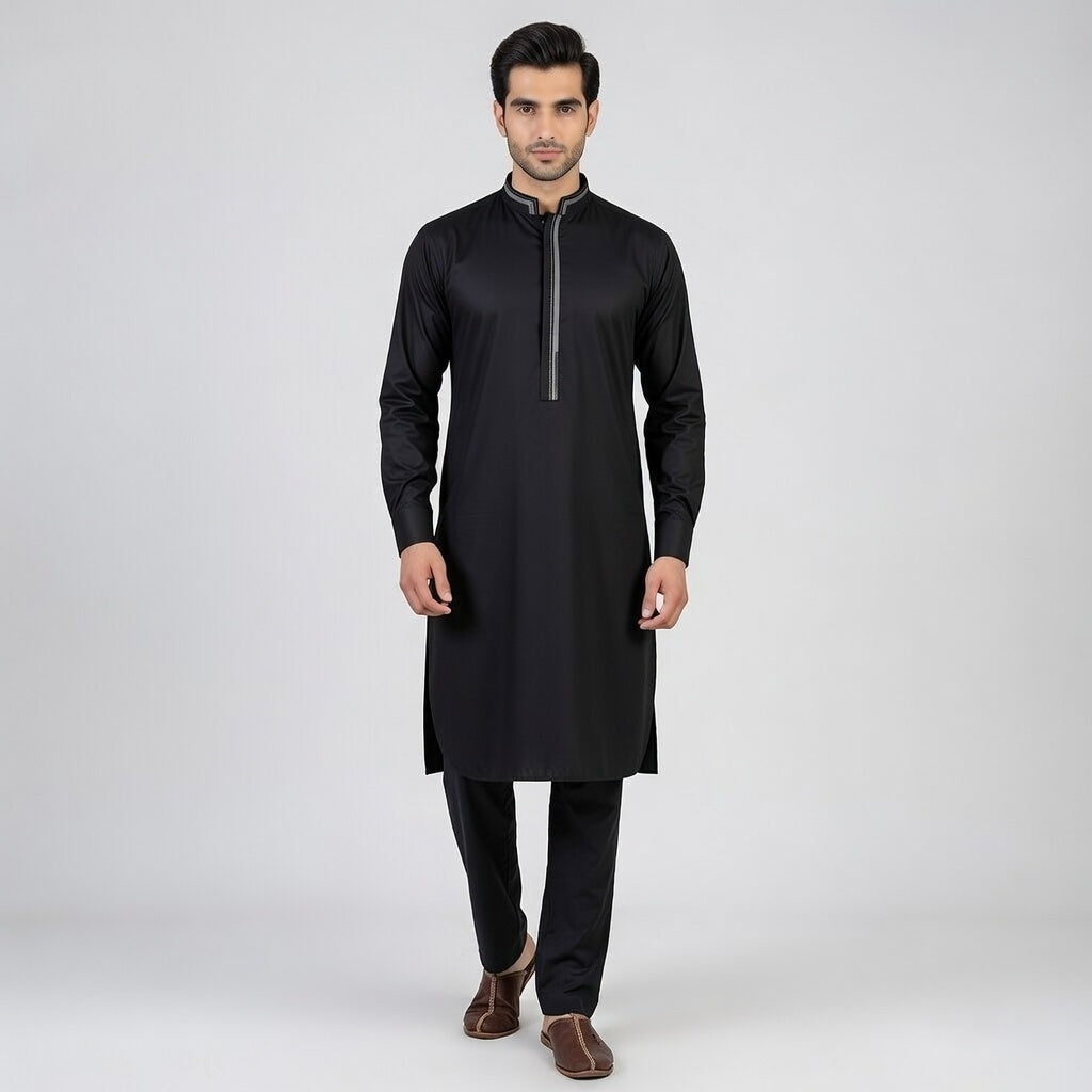 Man wearing a black kurta with a high collar on a white background