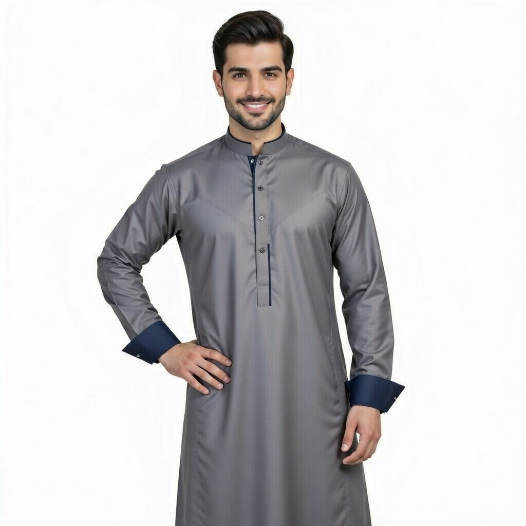 Man wearing a gray traditional outfit with navy cuffs on a white background