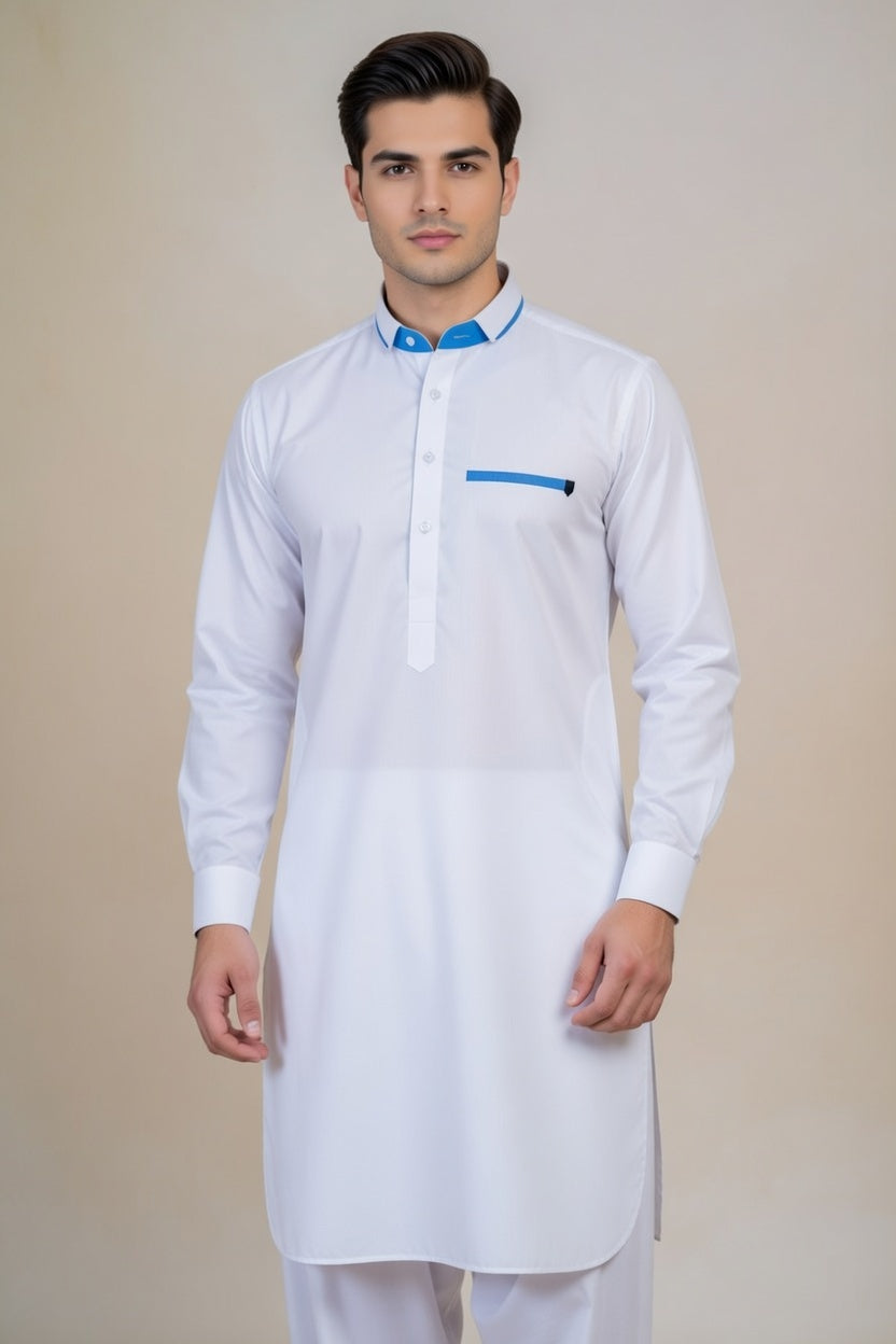 Man wearing a white kurta with blue accents on a beige background