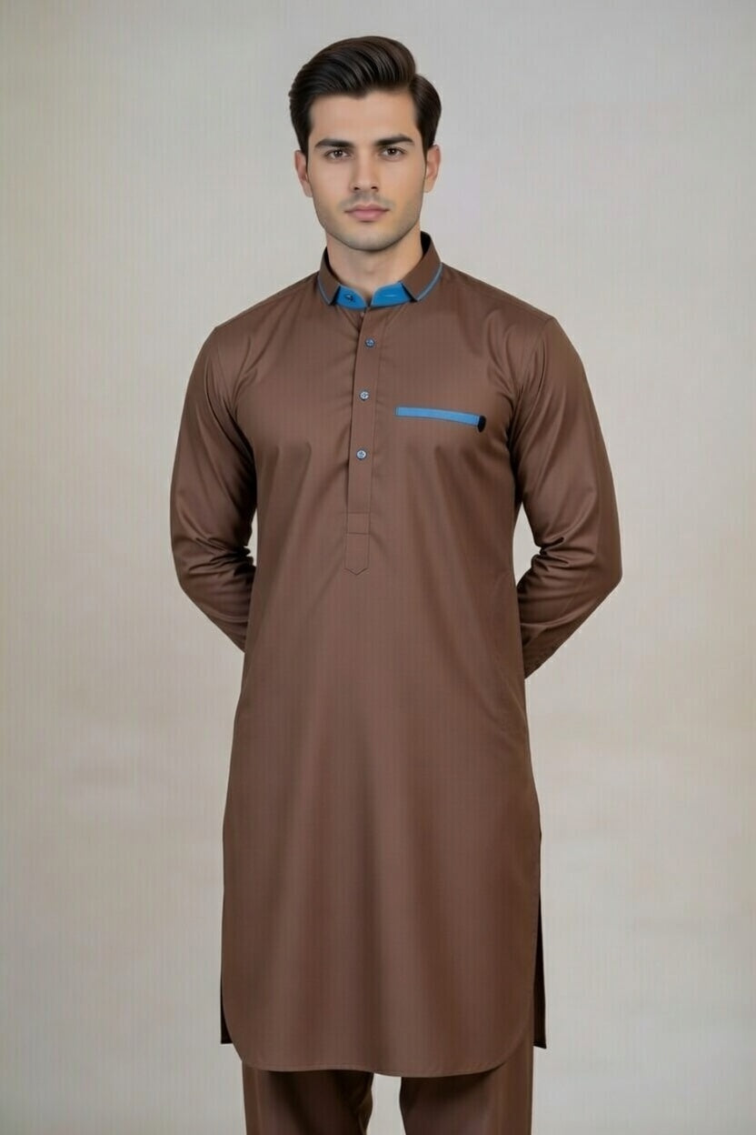 Man wearing a brown kurta with blue accents on a plain background