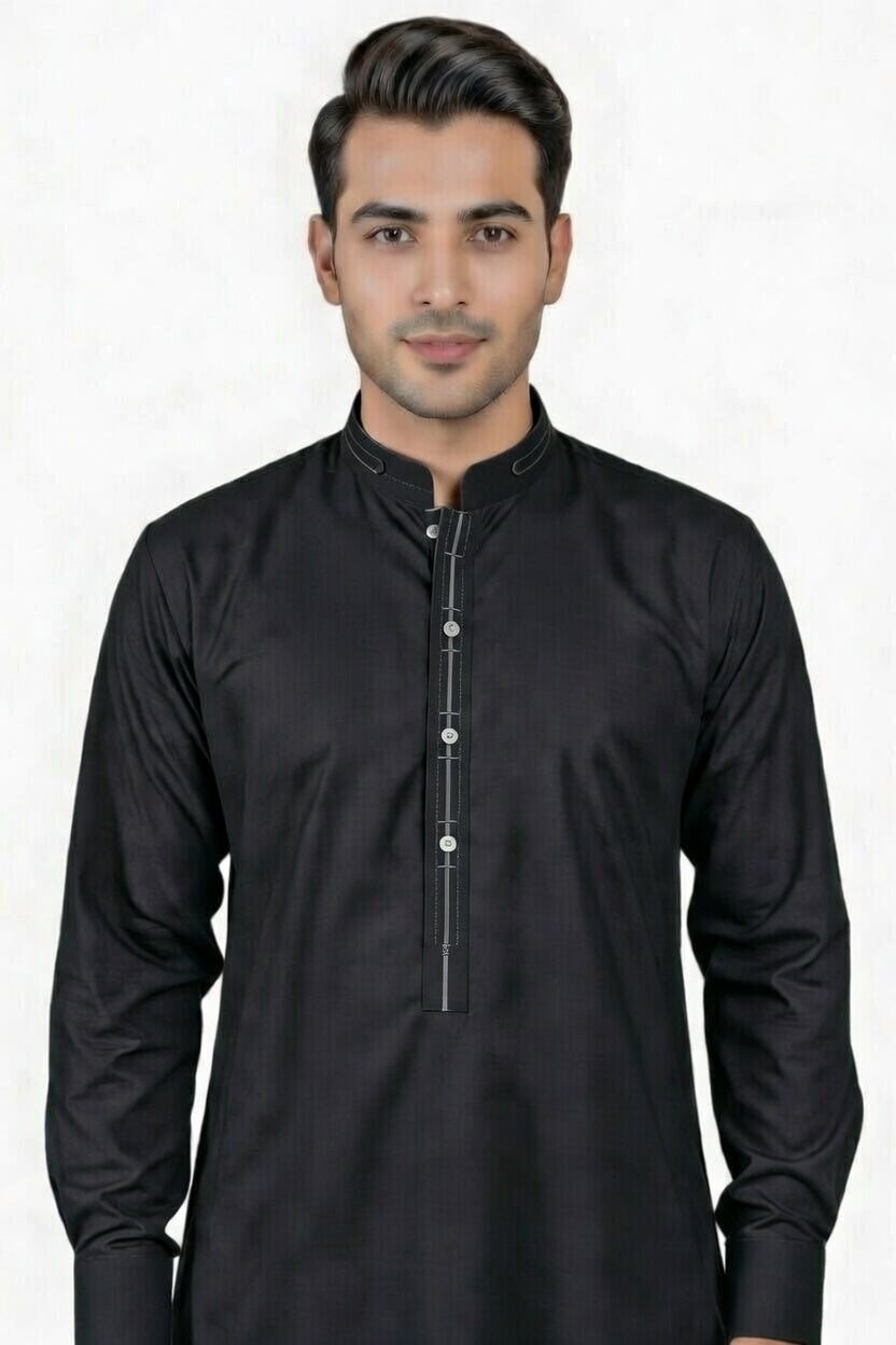 Man wearing a black kurta against a white background