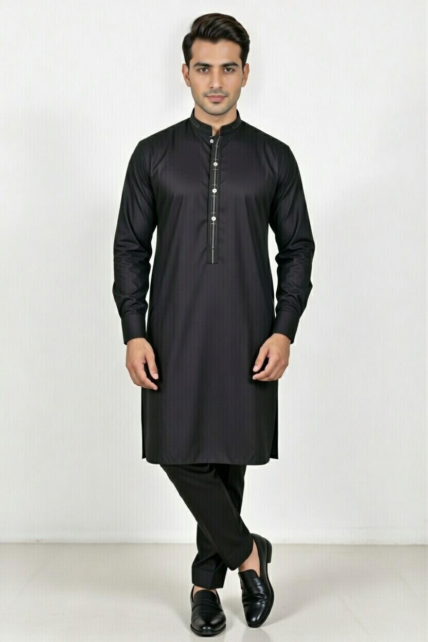 Man wearing a black kurta with black pants on a white background
