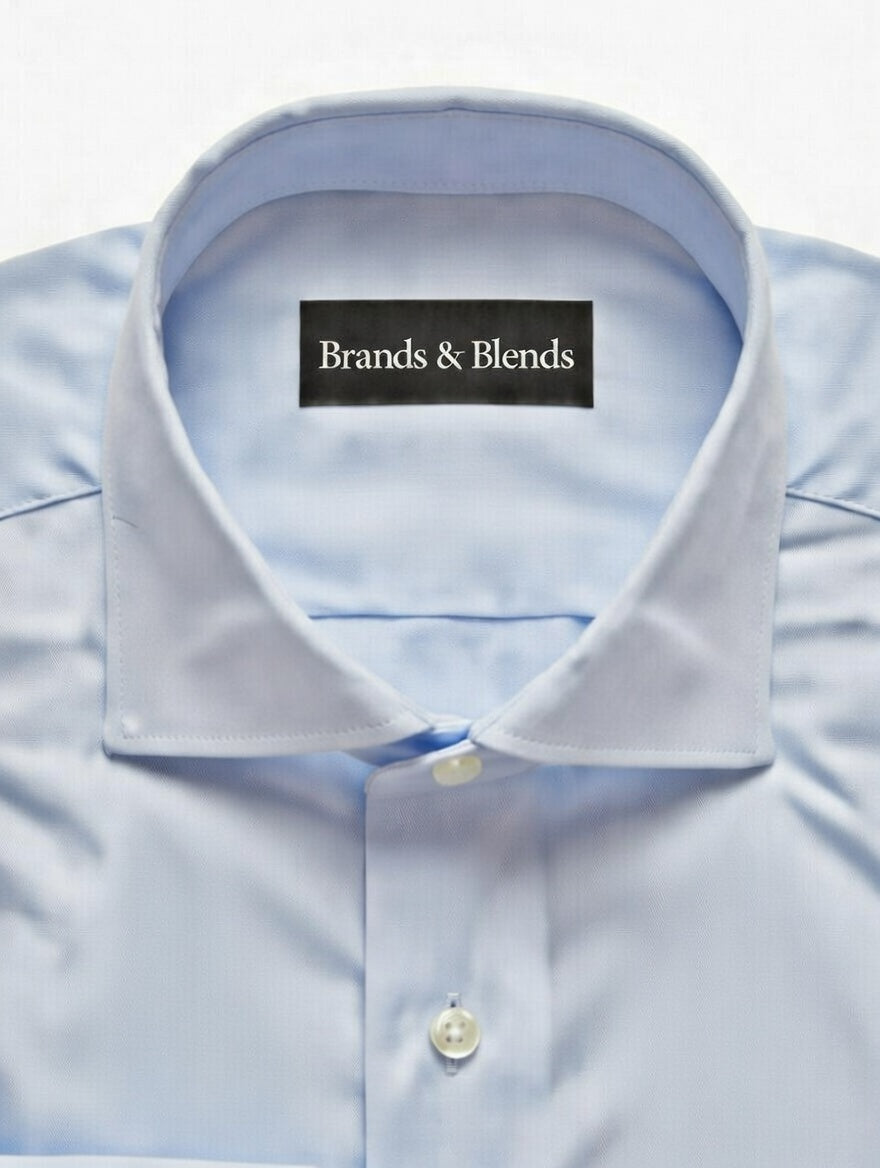 Light blue dress shirt with a collar and button, featuring 'Brands & Blends' label.
