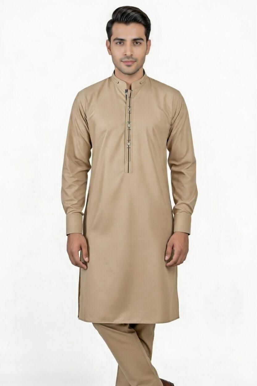 Man wearing a beige kurta with pants on a white background