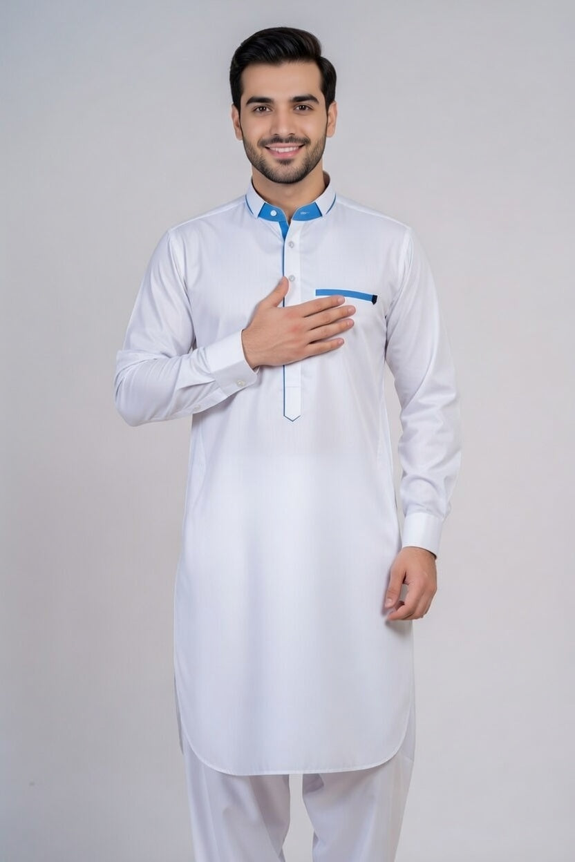 Man wearing a white kurta with blue accents on a plain background