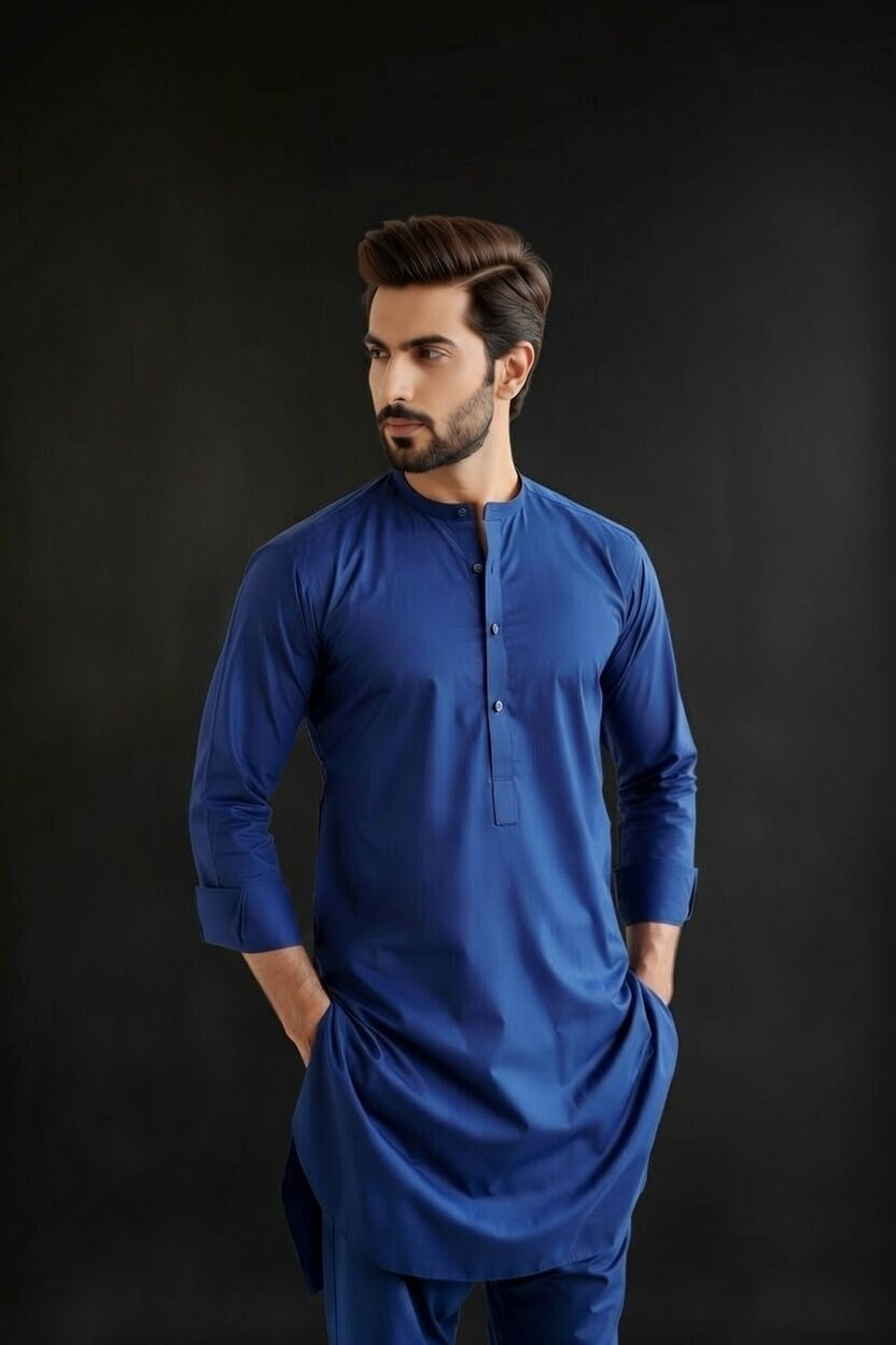 Man wearing a blue kurta with a black background
