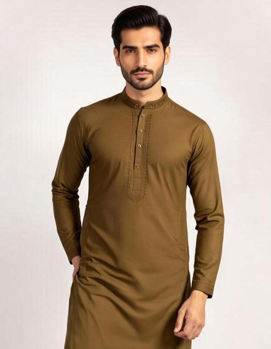 Man wearing a brown kurta against a white background