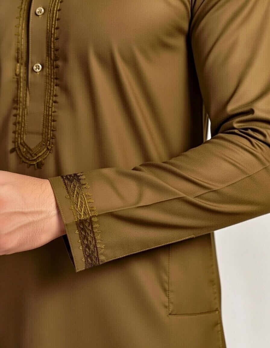 Brown long-sleeve shirt with intricate detailing on cuffs and collar against a white background
