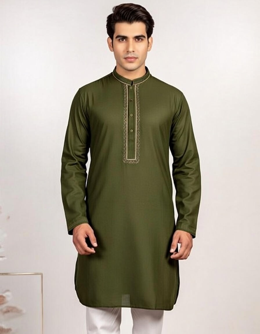 Man wearing a green kurta against a white background