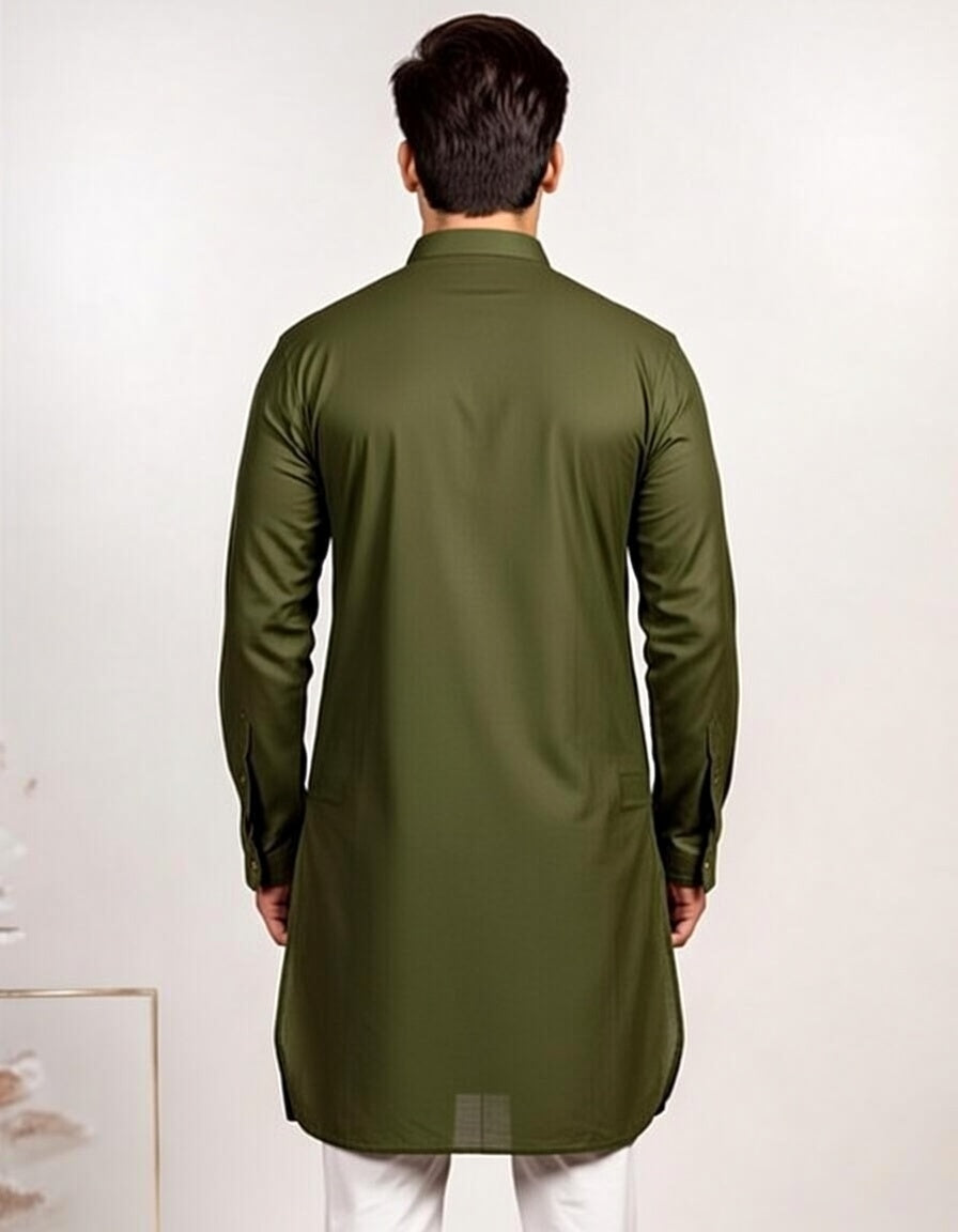 Man wearing a green kurta against a white background