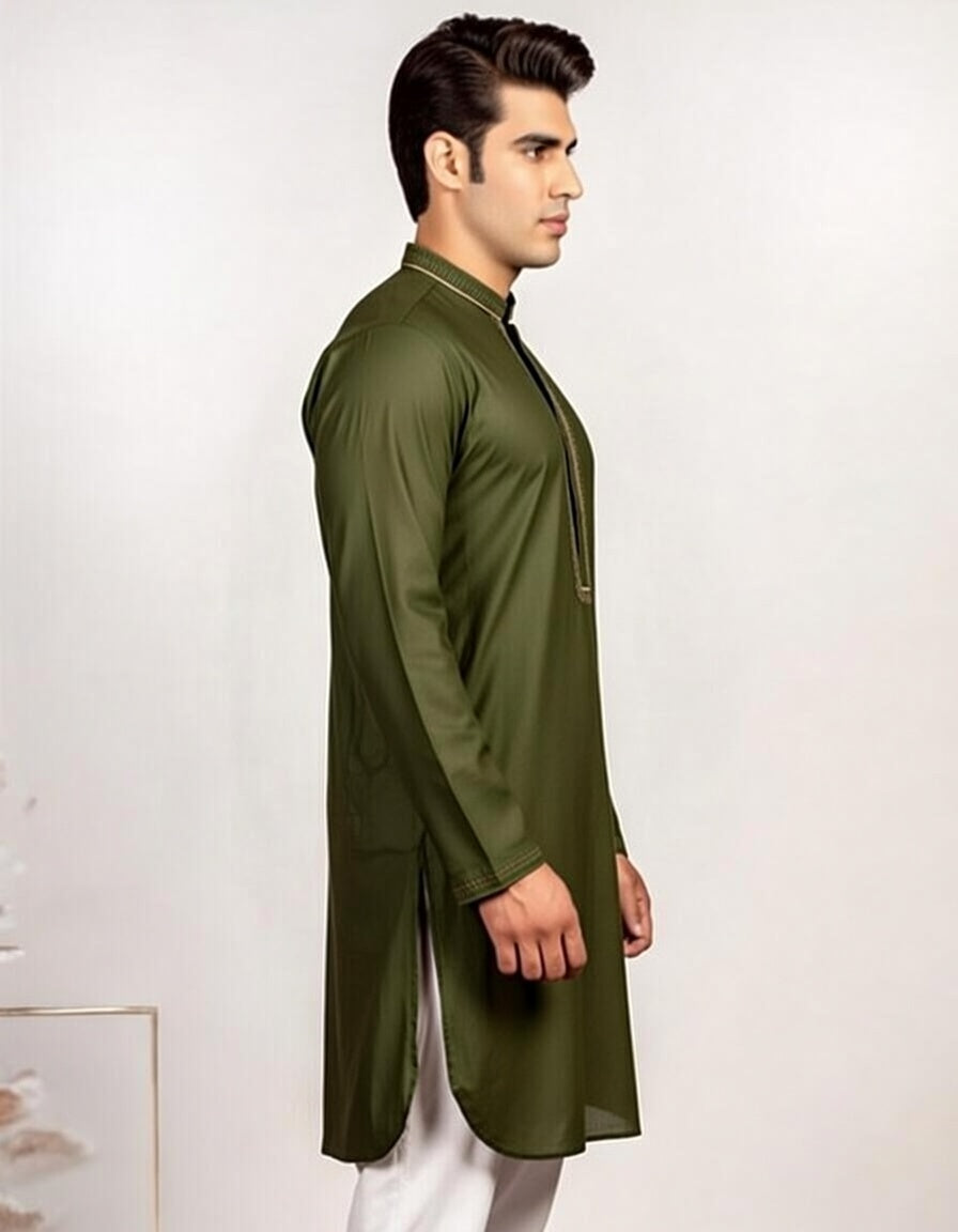 Man wearing a green kurta against a white background